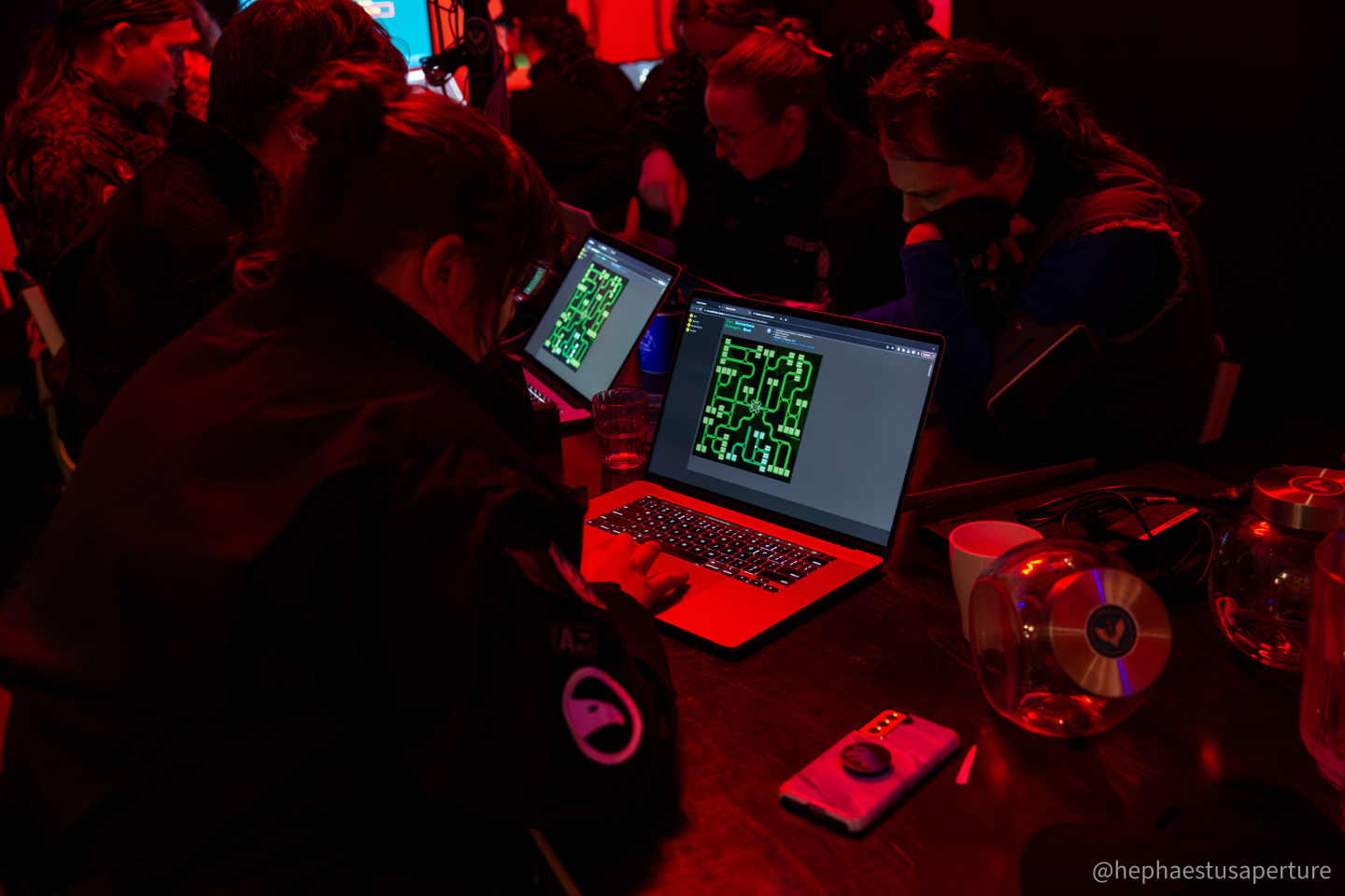 Picture of several hackers cooperating hacking a site using Attack Vector